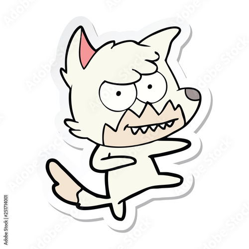 sticker of a cartoon grinning fox