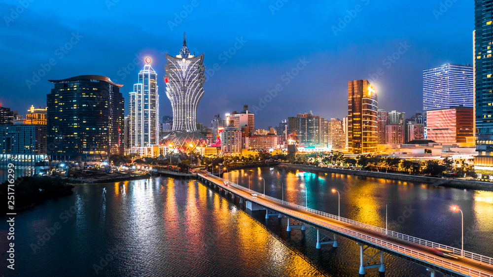 Obraz premium Macau cityscape at night, all hotel and tower are colorful lighten up with blue sky, Macau, China.