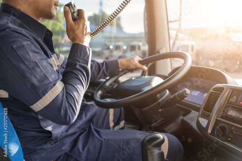 Truck Driver Making Talking Through Radio,Communication on the Highway,Concept transport on road,spot focus.