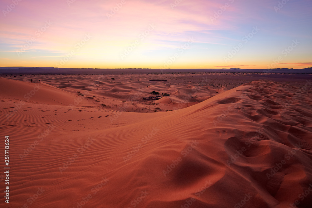 Beautiful colorful sunrise at a sand dune in Sahara desert Morocco Africa