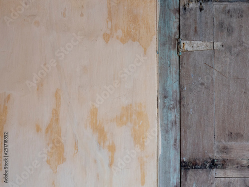 Background, texture of old plaster and painted wood. shutters on the facade © Serge Touch