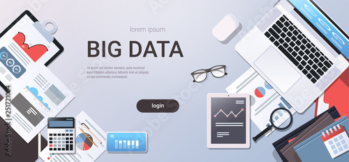 big data concept workplace desk with office stuff top angle view tablet laptop computer paper documents report finance graph flat copy space horizontal