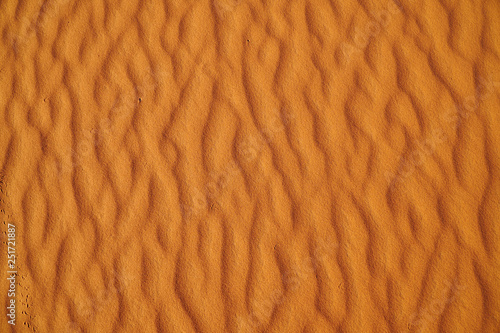 Close up texture pattern of golden desert sand in Sahara Africa