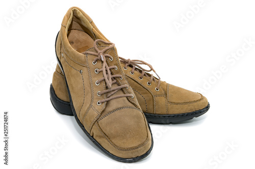 Women's spring suede shoes with lace-up beige color on an isolated background 