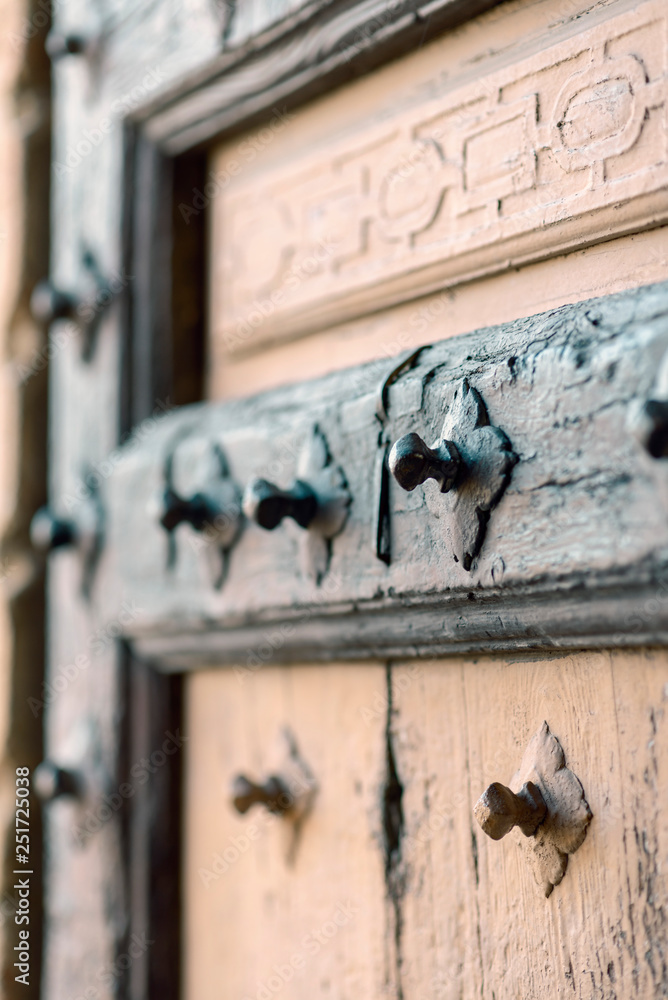 Fototapeta premium door decorated with metal bolts