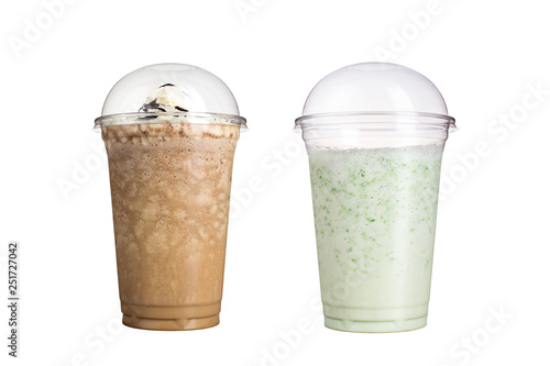Delicious fruit smoothies in plastic cups, on a white background. Two milkshakes with different flavors.