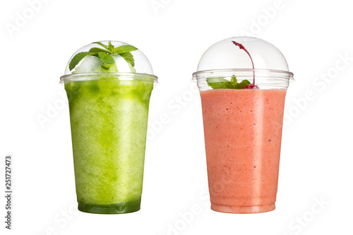 Delicious fruit smoothies in plastic cups, on a white background. Two cocktails with a taste of kiwi and cherry.