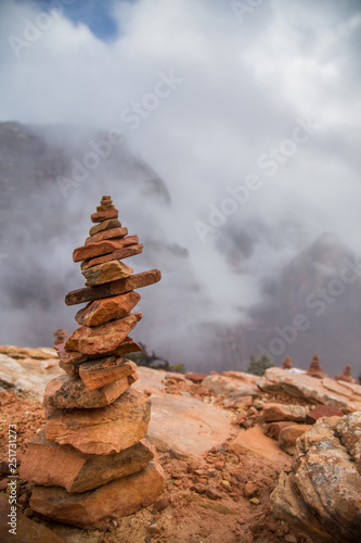 close up of Rock Cairn on top of Angel's Landing in Zion National Park on a cloudy day. Balanced rock tower. 