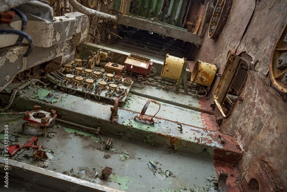 Internal parts of decommissioned marine ship that was cut and left on the shore.