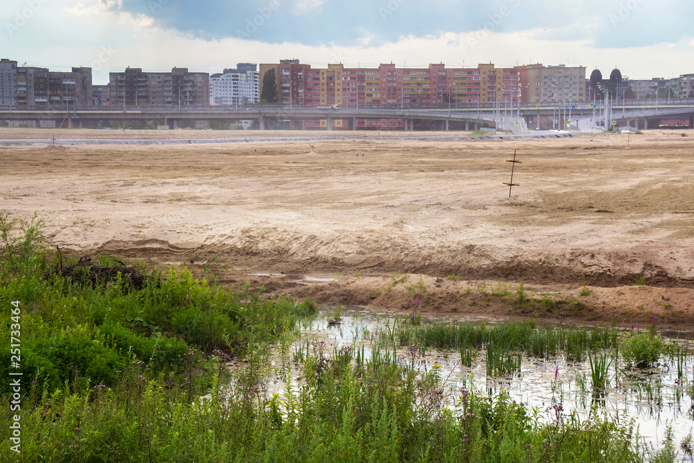 Wasteland (territory for new stadium) in a residential area on the suburb of Kaliningrad near the island of Lomze. Russia. Wasteland (territory for new stadium) in a residential area on the suburb of Kaliningrad near the island of Lomze. Russia.