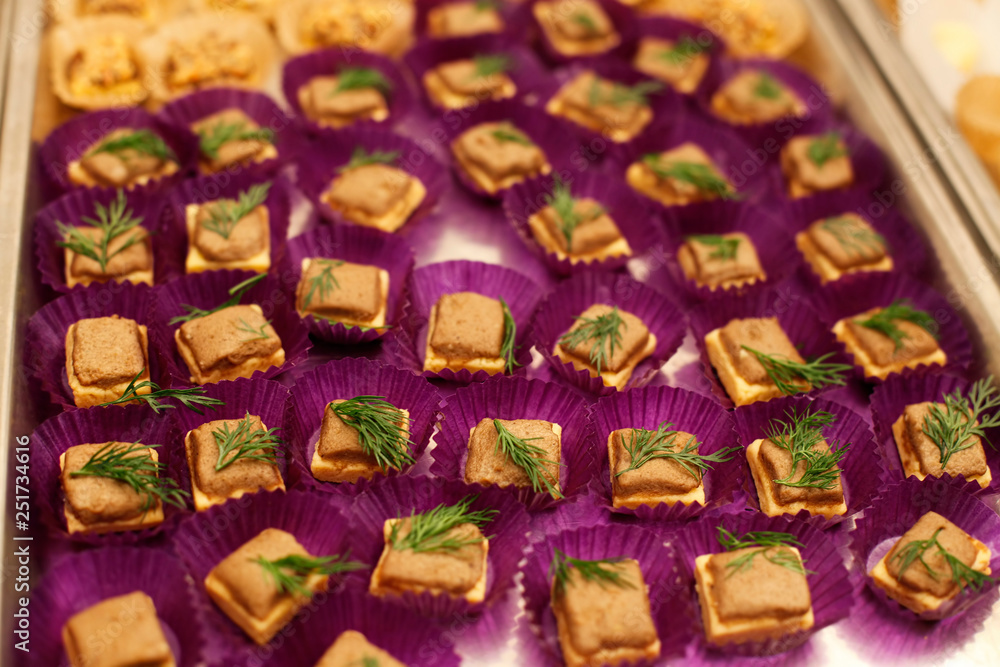 Fish patte canape buffet meal in purple paper cups Fish patte canape buffet meal in purple paper cups