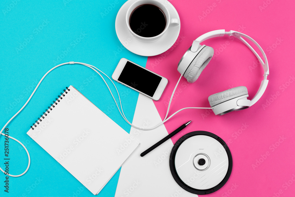 Headphones with cord on a bright color block background - obrazy, fototapety, plakaty 