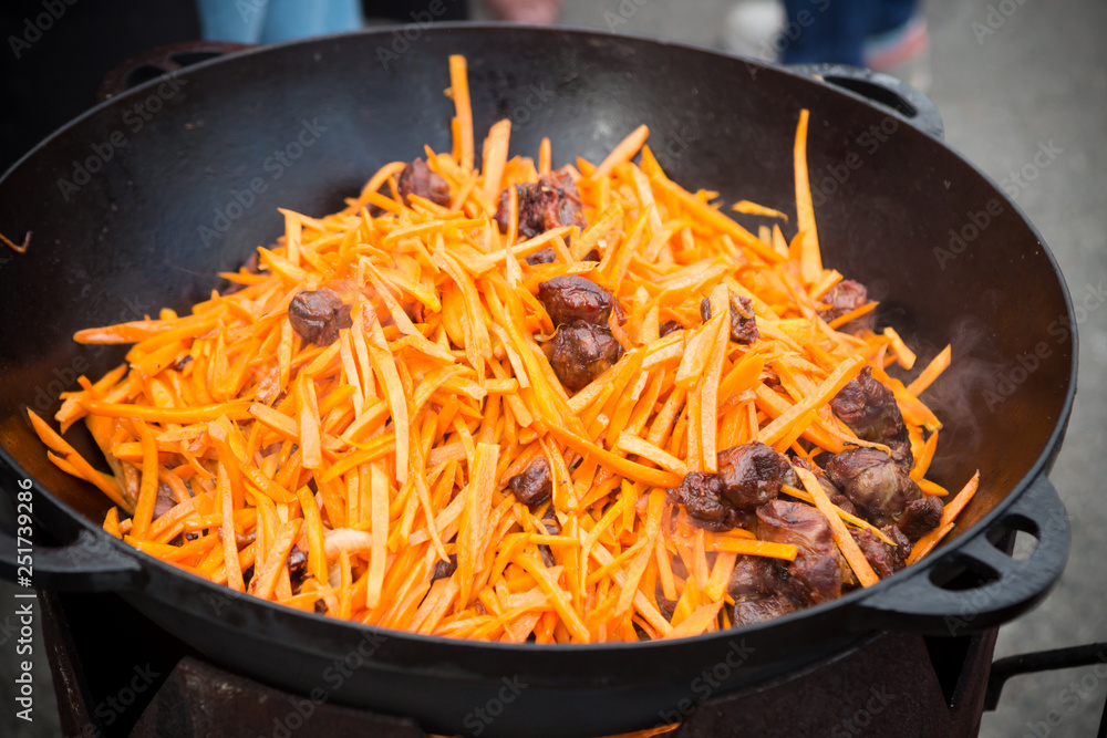 Traditional pilaf rice dish in a cauldron Traditional pilaf rice dish in a cauldron