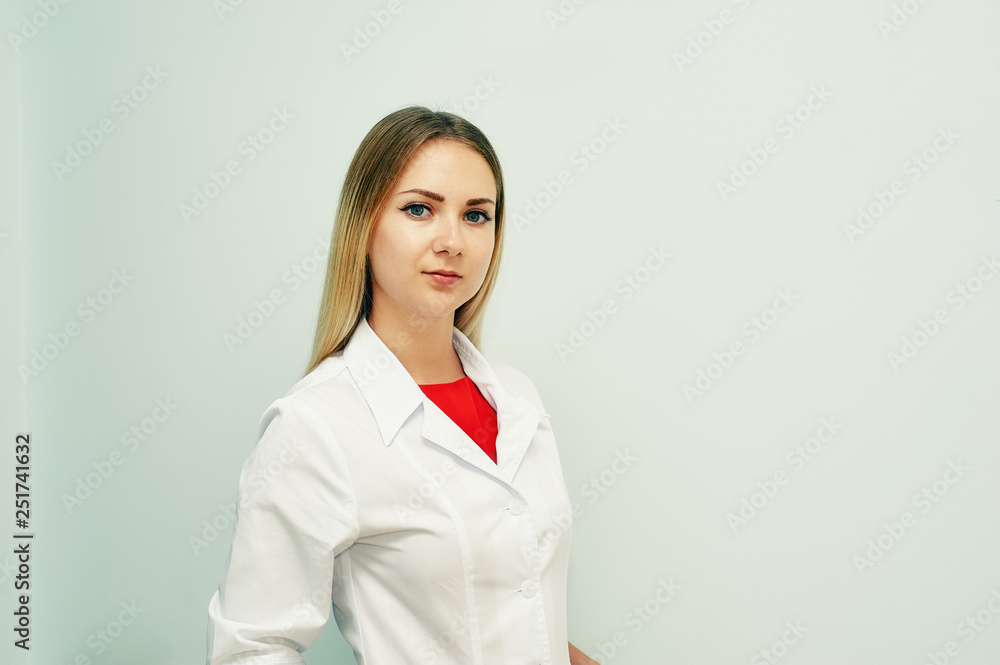 Portrait of a young girl in a white medical gown Portrait of a young girl in a white medical gown