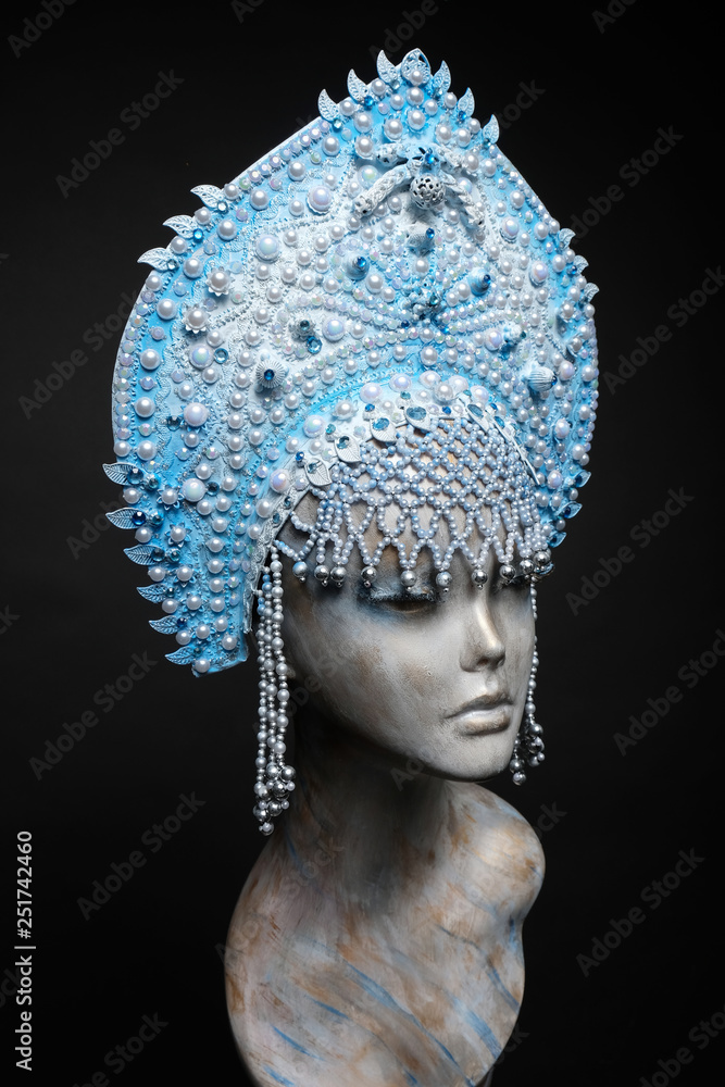 Woman mannequin head in blue decorated Russian kokoshnick