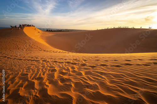 MUI NE  VIETNAM - JANUARY 18  2019   Unidentified tourists are traveling red sand dunes in Binh Thuan near the town of Mui Ne  Vietnam. Mui Ne is popular travel destination with long coastline..