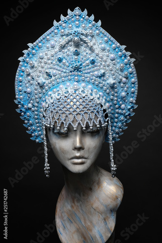 Woman mannequin head in blue decorated Russian kokoshnick