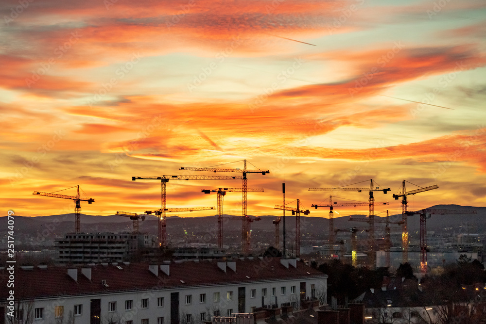 Panoramic view of a sunset over Viennas Wienerberg with a construction site