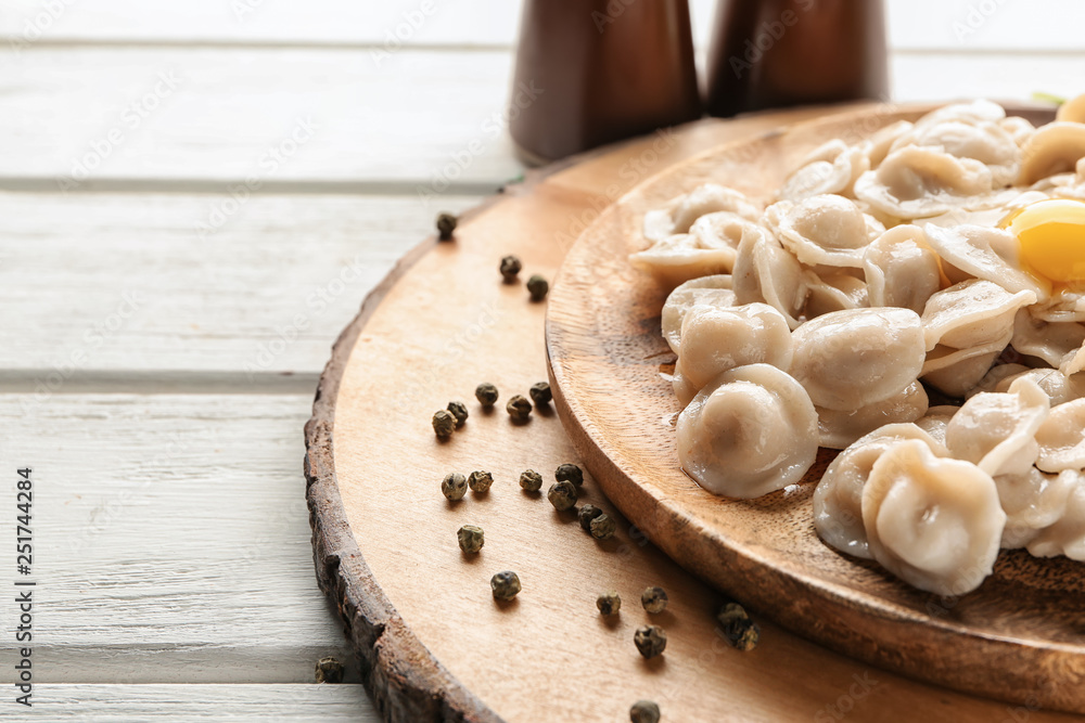 Plate with tasty dumplings on table, closeup Plate with tasty dumplings on table, closeup