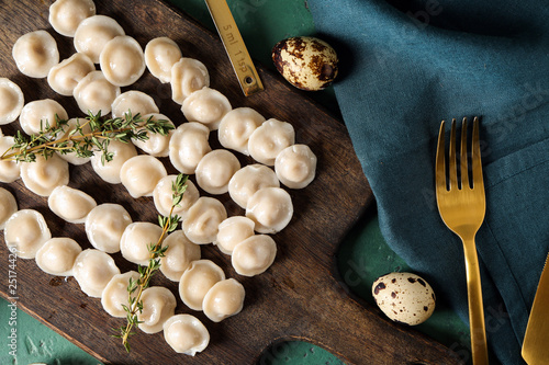 Board with tasty dumplings on table