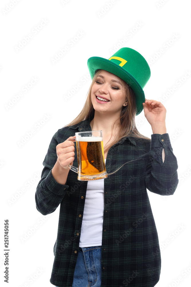 Beautiful young woman with green hat and mug of beer on white background. St. Patrick's Day celebration