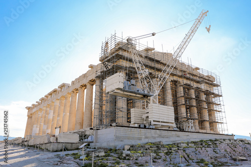 Athens, Greece - March 14, 2017: Western facade of the Parthenon temple on the Acropolis of Athens, Greece under reconstruction during spring 2017.