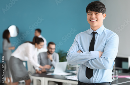 Young Asian businessman at ...