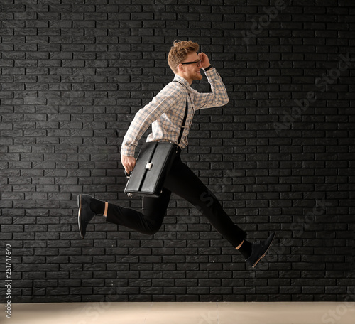 Jumping businessman with st...