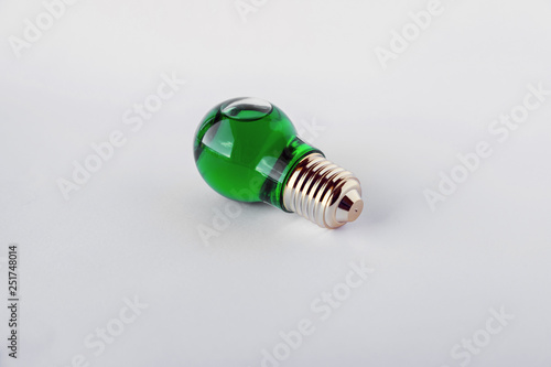 small green alkaholic bottle in lamp shape