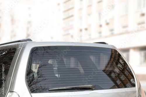 Modern car with clean rear window outdoors photo