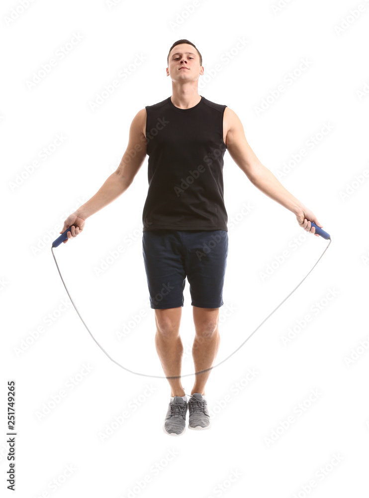 Sporty young man jumping rope against white background Sporty young man jumping rope against white background