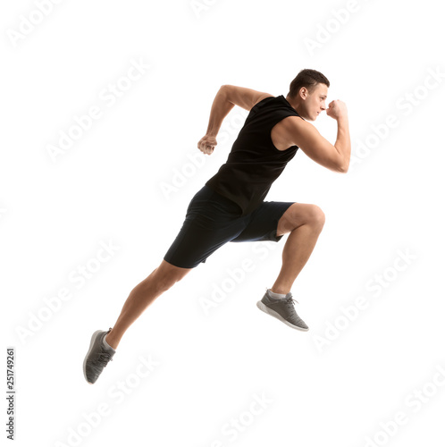 Sporty young man running against white background © Pixel-Shot