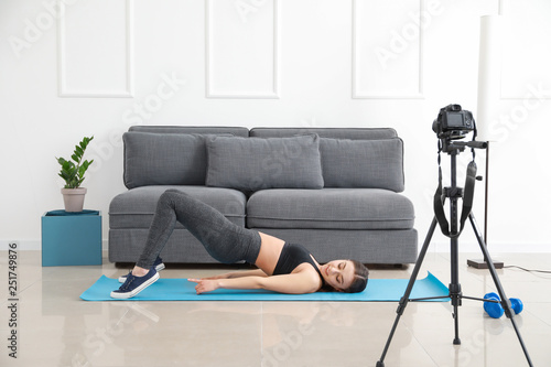 Young woman recording onlin...