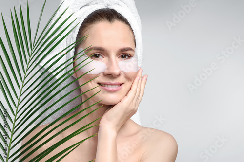 Woman with under-eye patche...
