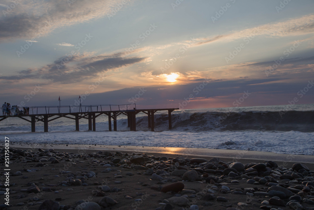 Obraz premium Exotic Paradise, sunset. Travel, Tourism and Vacations Concept. black sea Dock on the beach Batumi. The city embankment