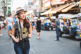 Asian woman tourist backpacker travel in Khao San road, Bangkok, Thailand