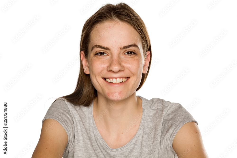 Young smiling woman without makeup on white background Young smiling woman without makeup on white background