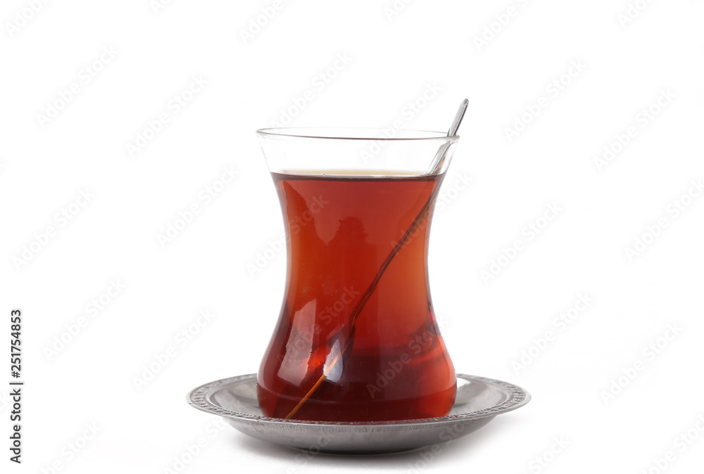 Turkish tea in traditional glass isolated on white background Turkish tea in traditional glass isolated on white background