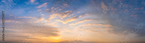 beautiful clouds in warm pastel colors during sunrise - high resolution panorama