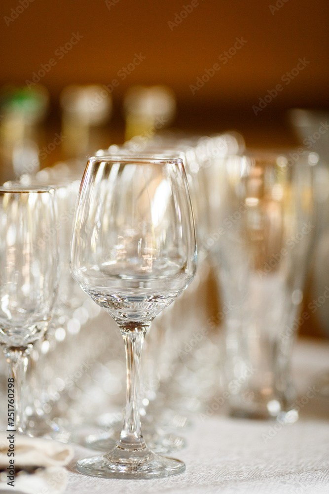 Glasses for wine and champagne at a buffet table Glasses for wine and champagne at a buffet table