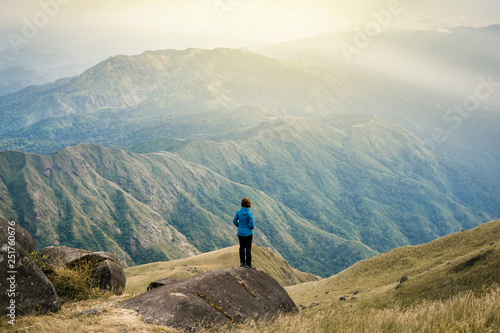  Instagram filter young Asia tourist at mountain is watching over the misty and foggy morning sunrise, travel Trekking