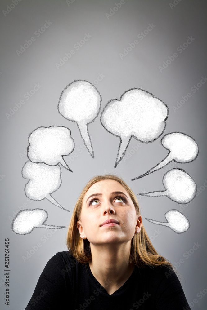 Young woman in black and blank speech bubbles Young woman in black and blank speech bubbles