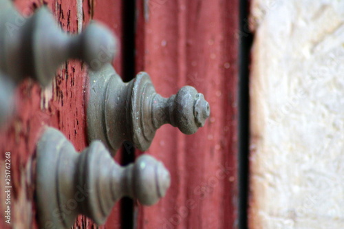 Bolts in red door, Alenquer, Portugal photo