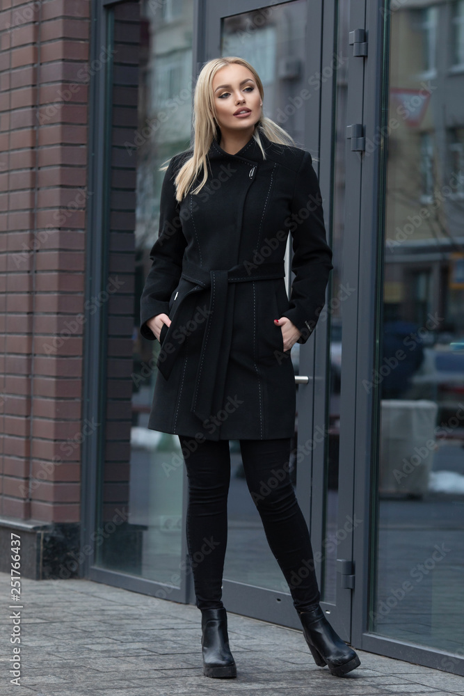 young stylish beautiful woman walking in street, wearing coat , fashion outfit, autumn trend. young stylish beautiful woman walking in street, wearing coat , fashion outfit, autumn trend.