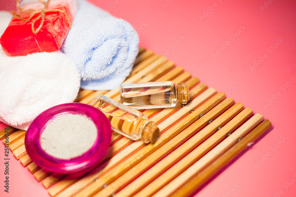 Spa concept. Pink and green salt inside the glass. Blue and red clay. Top view. Space for your text. Spa concept. Pink and green salt inside the glass. Blue and red clay. Top view. Space for your text.