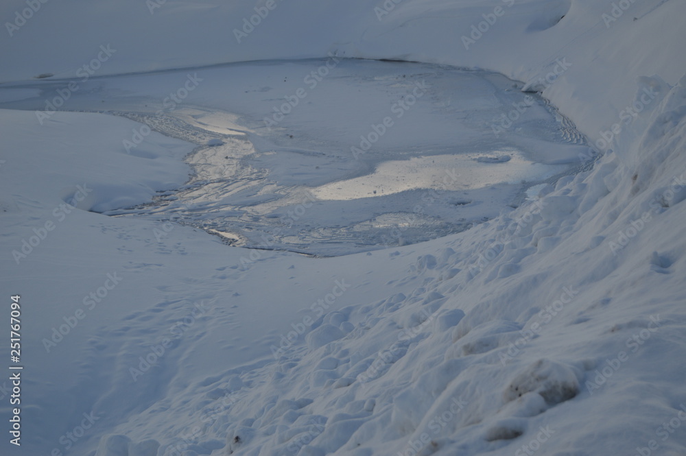 Fototapeta premium Nice Ice Lake In Crete Of Bataillence In Aragnouet. Nature, Travel, Landscapes. December 29, 2014. Aragnouet, Midday-Pyrenees, France.