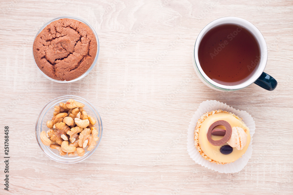 Food concept. Cakes and cup of delicious tea for happy day. Top view. Space for a text. Food concept. Cakes and cup of delicious tea for happy day. Top view. Space for a text.