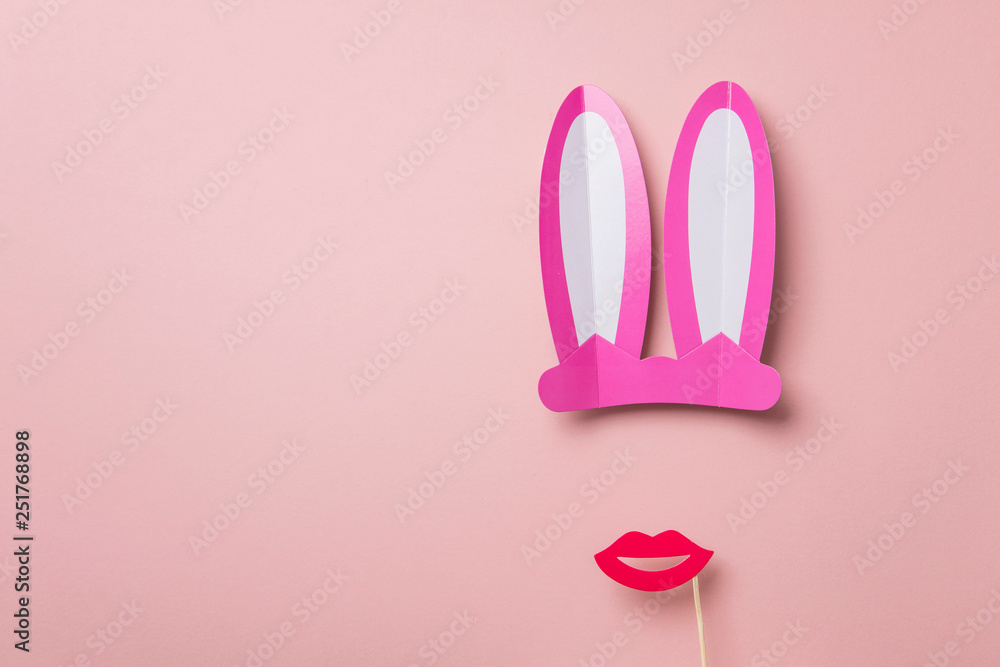 Pink Easter bunny ears and red lips. Minimal lay flat design