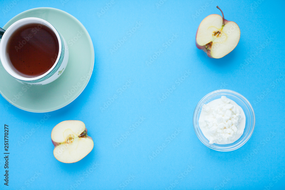 Healthy food concept. Fruits and curd on the blue background. Top view. Space for a text. Healthy food concept. Fruits and curd on the blue background. Top view. Space for a text.