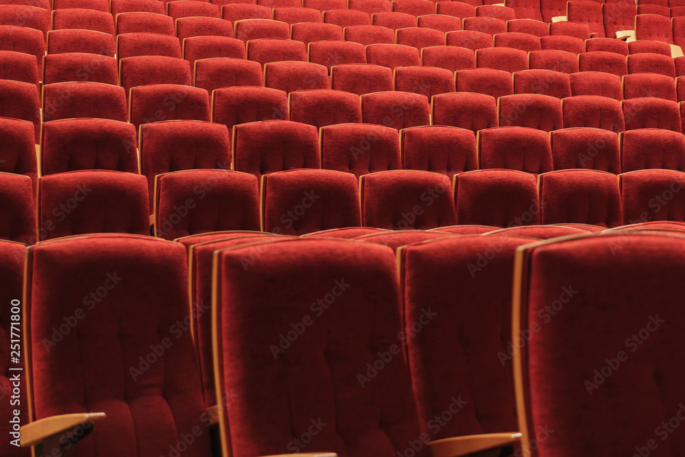Obraz premium Red chairs in the auditorium at the concert, texture, background